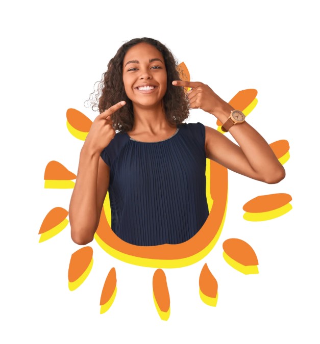smiling girl pointing to her teeth